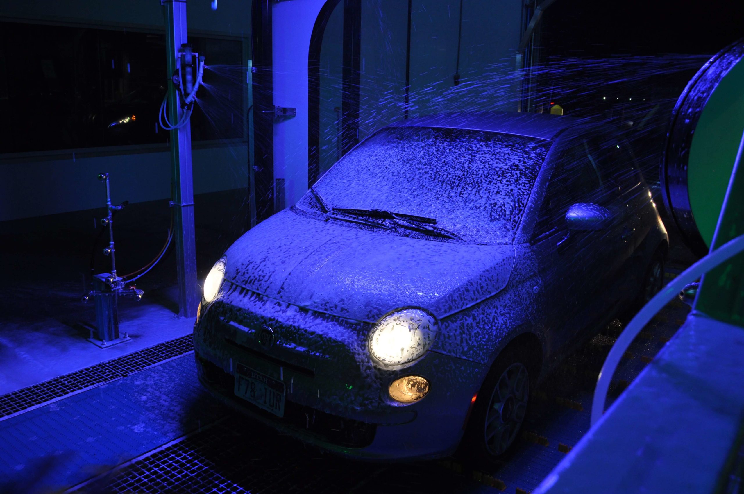 Car inside of tunnel covered in blue foam